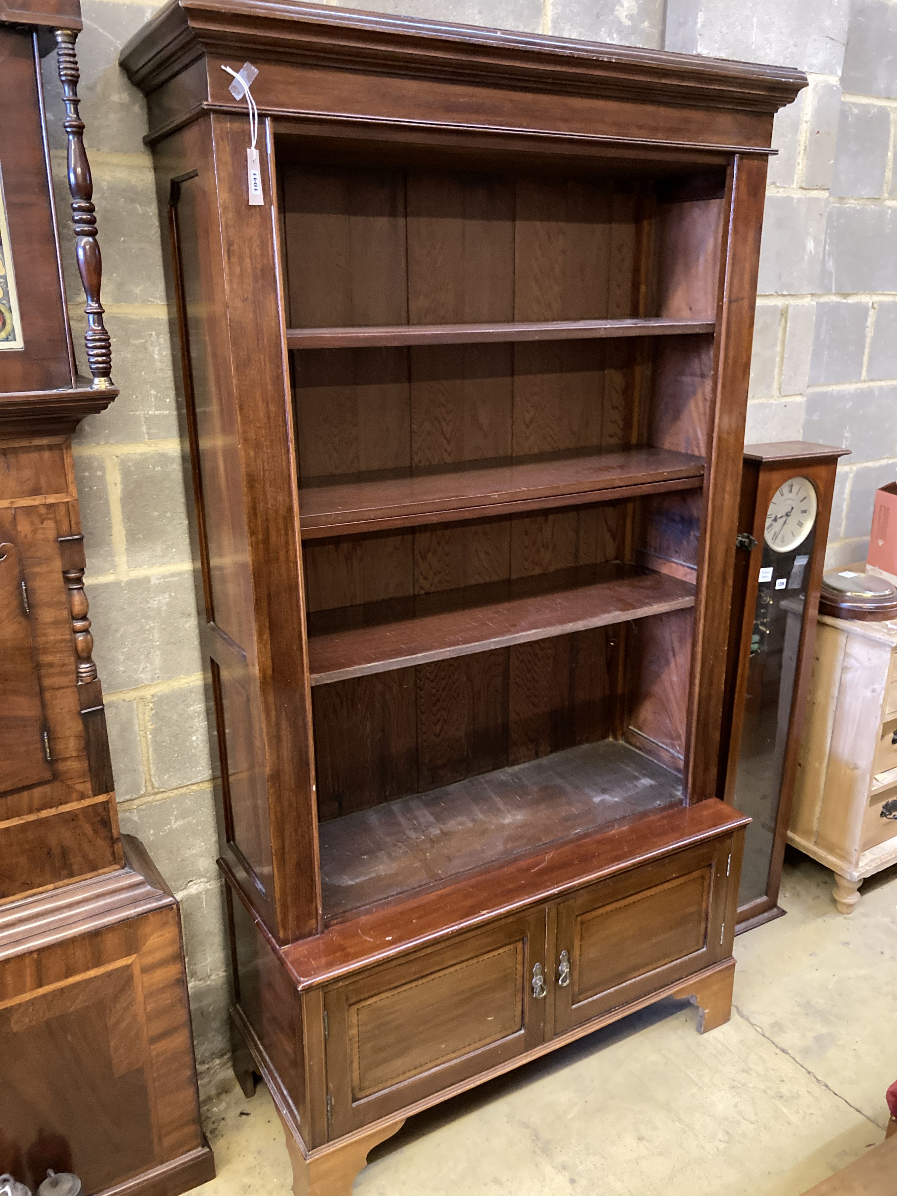 A mahogany open bookcase cupboard, length 110cm, depth 46cm, height 198cm